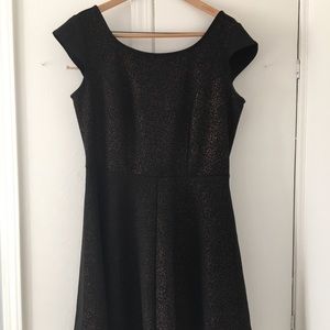 Black skater dress with subtle leopard detail.
